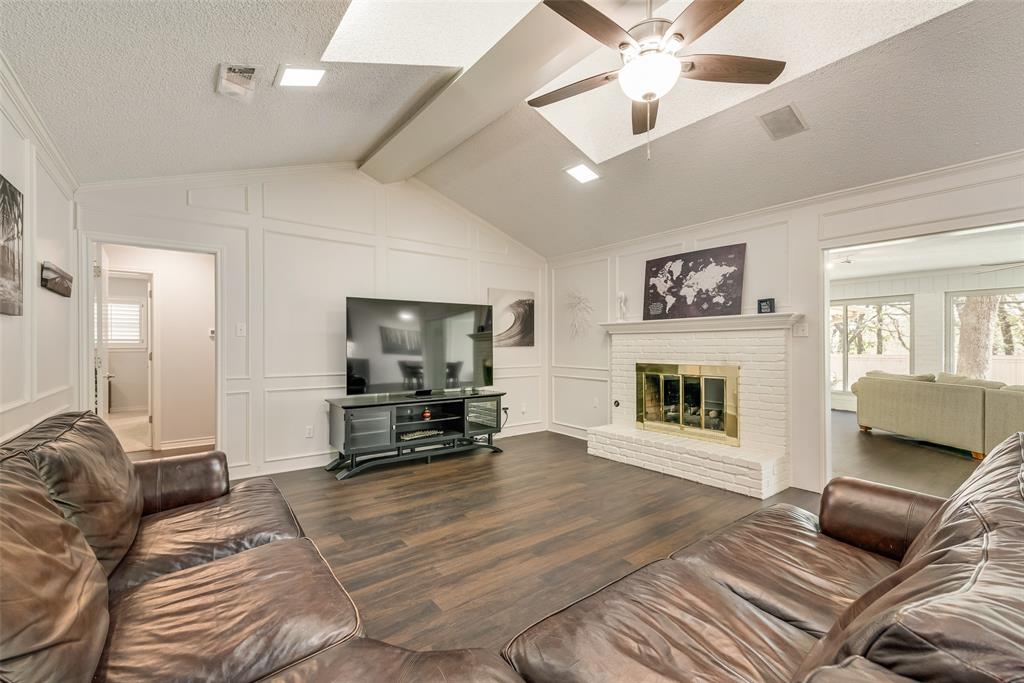 805 Crowley Road Arlington, TX 76012 - Photo 13 of 26 a living room with furniture and a fireplace