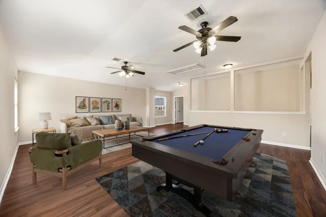 a living room with furniture and white walls