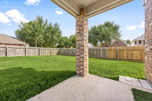 a view of a back yard with a small garden