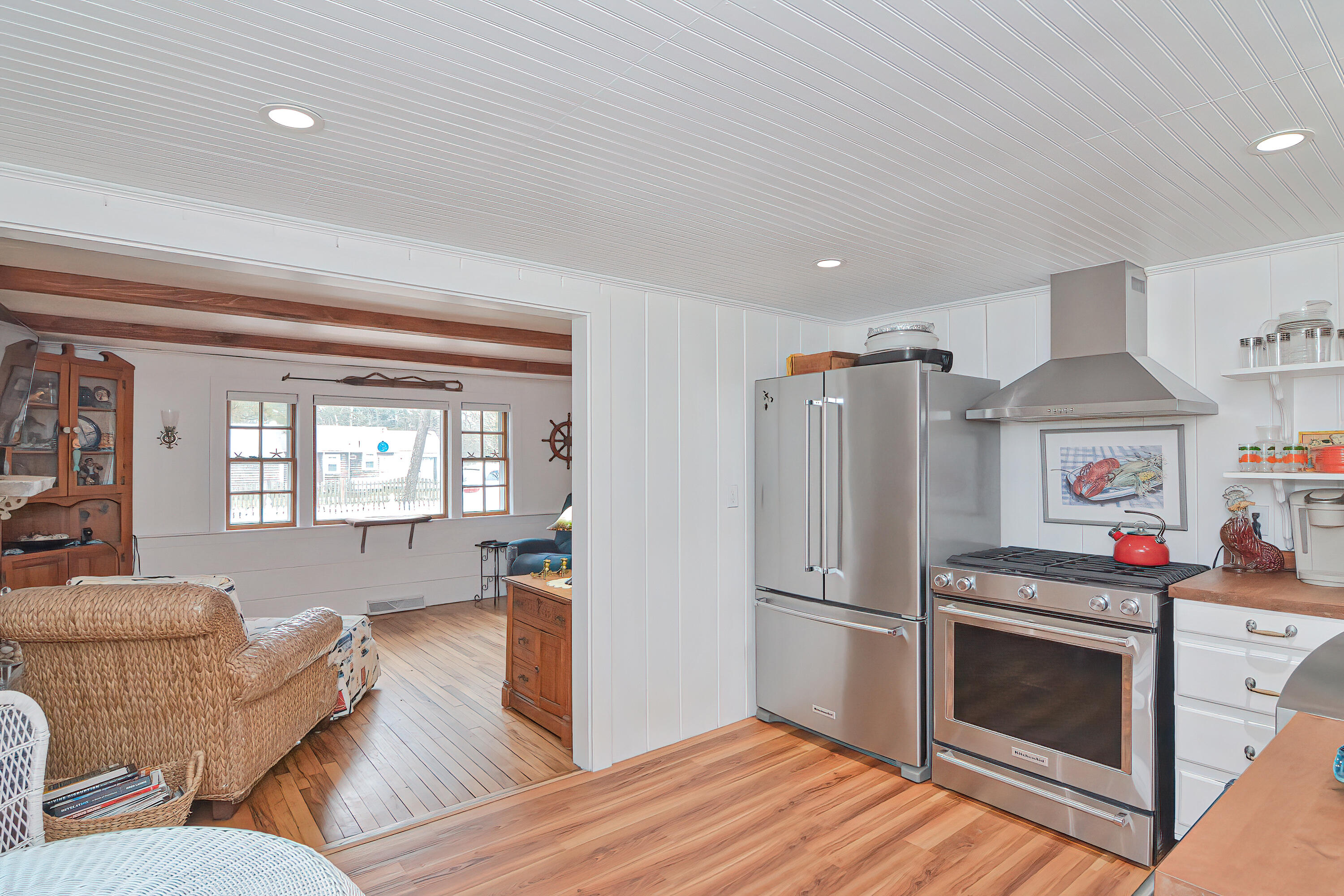 31 Susan Ruth Road Dennis Port, MA 02639 - Photo 1 of 27 a kitchen with stainless steel appliances granite countertop a refrigerator and wooden cabinets