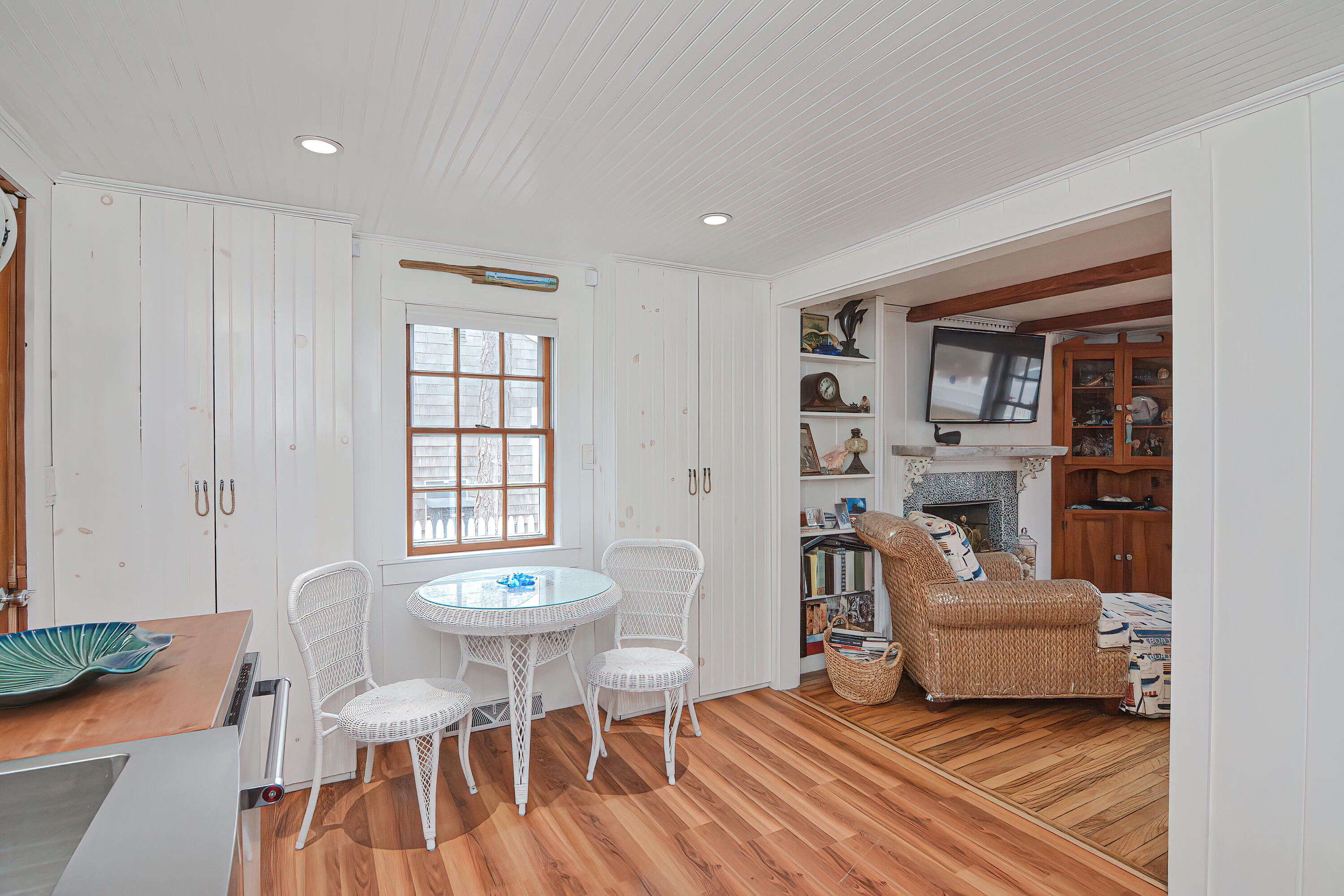 31 Susan Ruth Road Dennis Port, MA 02639 - Photo 4 of 27 a living room with a couch and a table with wooden floor