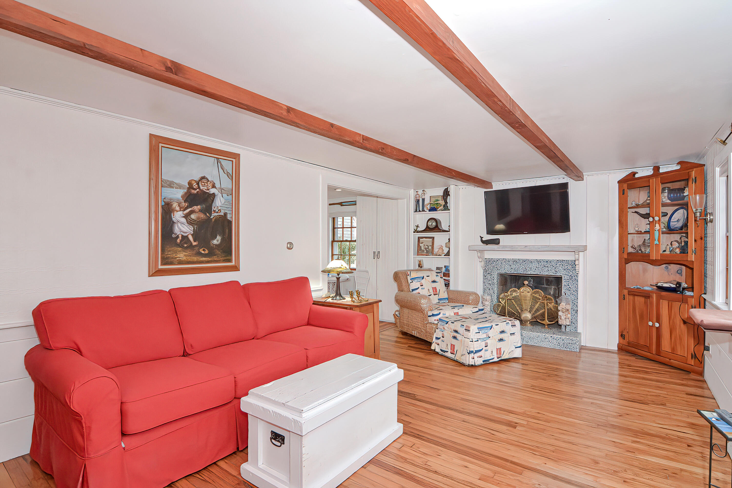 31 Susan Ruth Road Dennis Port, MA 02639 - Photo 5 of 27 a living room with furniture fireplace and wooden floor