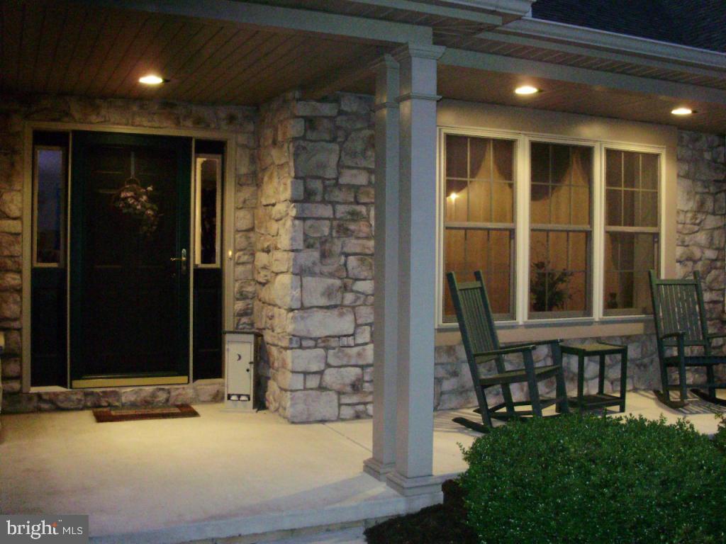 450 Gockley Road Stevens, PA 17578 - Photo 3 of 35 a view of house with a large window and fire pit