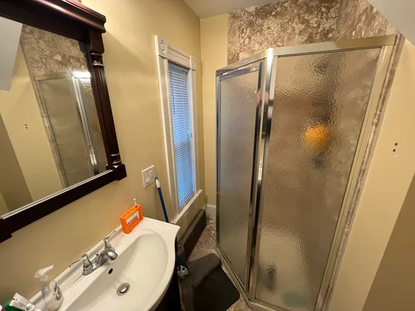 a bathroom with a bathtub and a shower