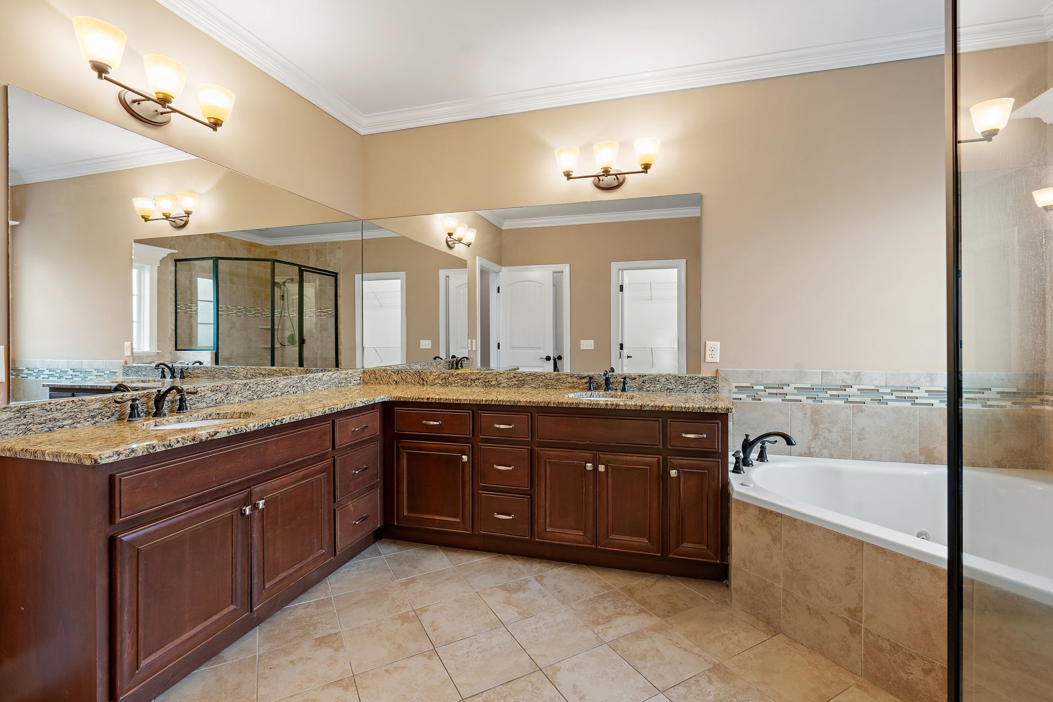 7670 Knobdate Road Smyrna, TN 37167 - Photo 15 of 29 a spacious bathroom with a granite countertop tub sink and mirror