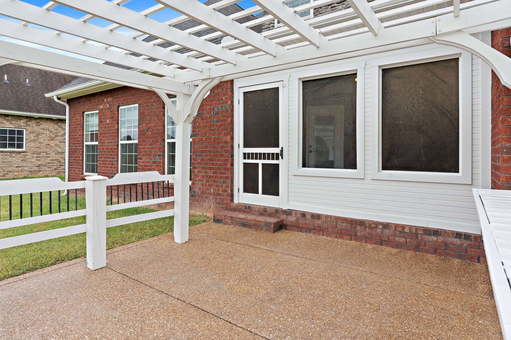 7670 Knobdate Road Smyrna, TN 37167 - Photo 24 of 29 a view of a brick house with large windows