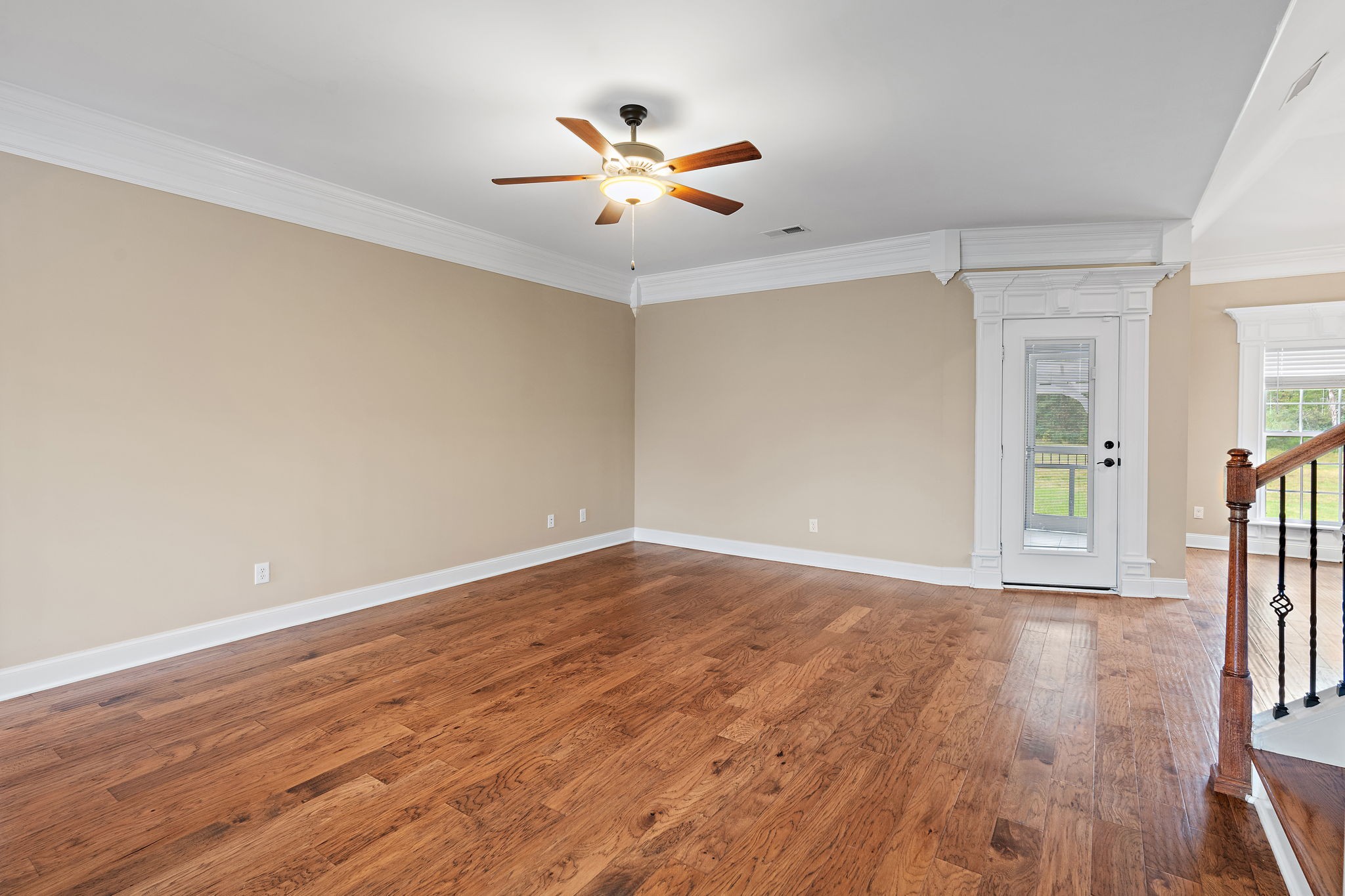 7670 Knobdate Road Smyrna, TN 37167 - Photo 6 of 29 wooden floor in an empty room with a window