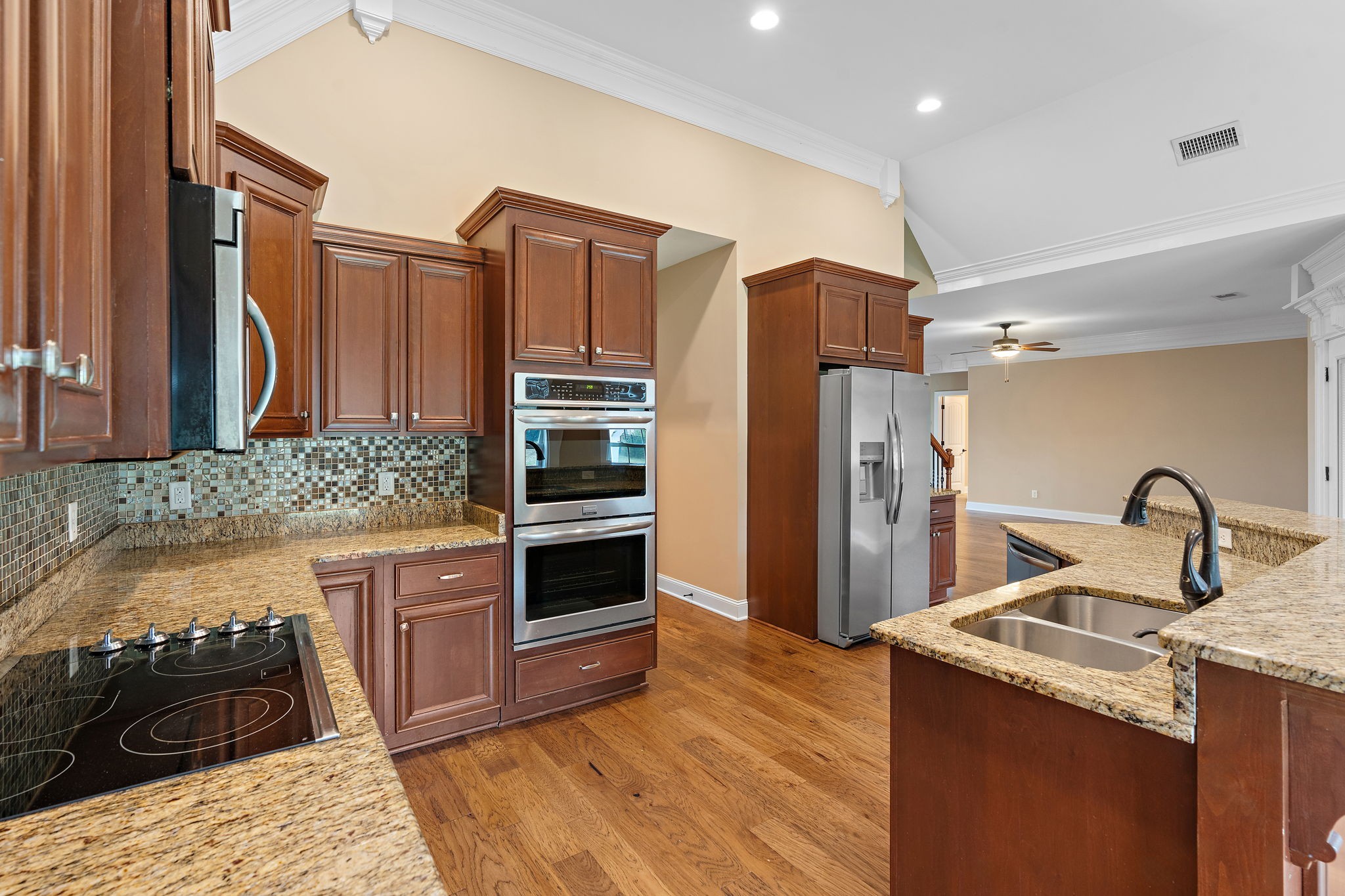 7670 Knobdate Road Smyrna, TN 37167 - Photo 9 of 29 a kitchen with granite countertop a refrigerator and a sink