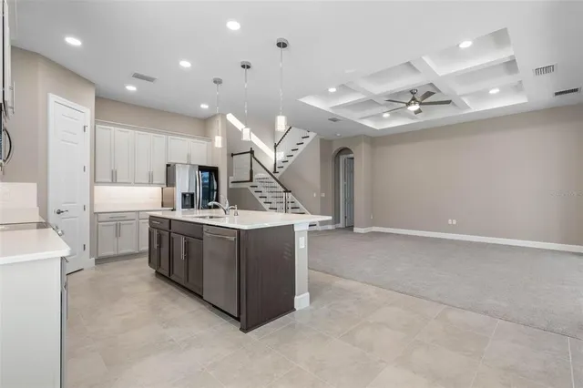 a bed room with a bed and a chandelier