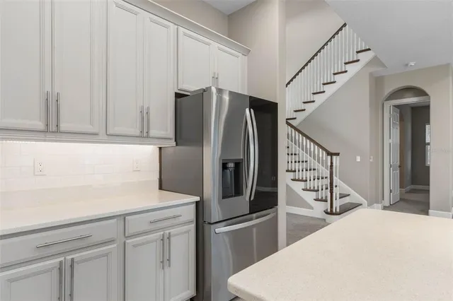 a spacious bathroom with a double vanity sink a mirror and a bathtub