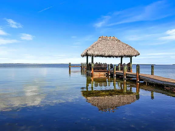 a view of a swimming pool with a table and chairs