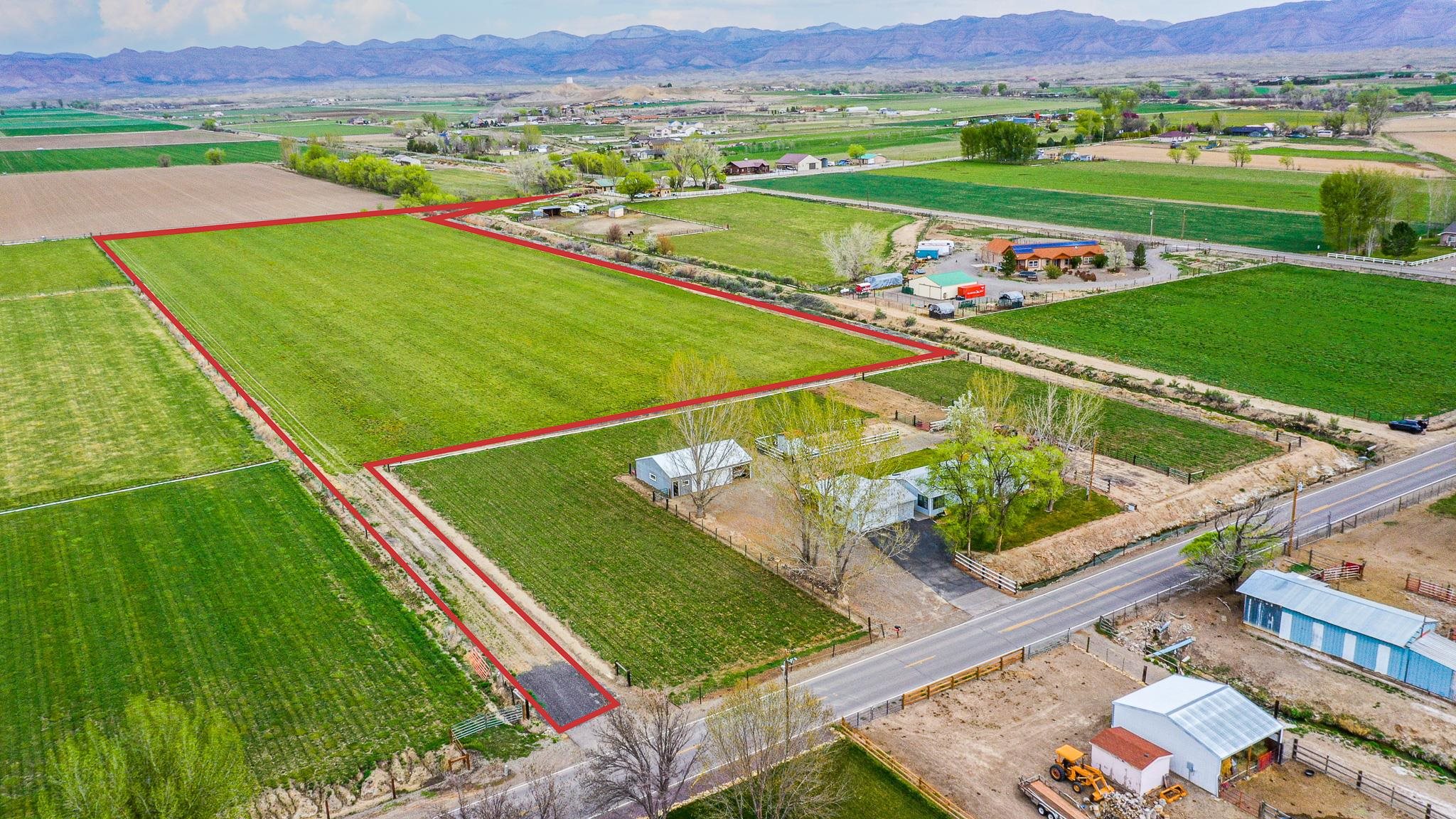 1786 North 3/10 Road Fruita, CO 81521 - Photo 1 of 11 a view of a two chairs in the park