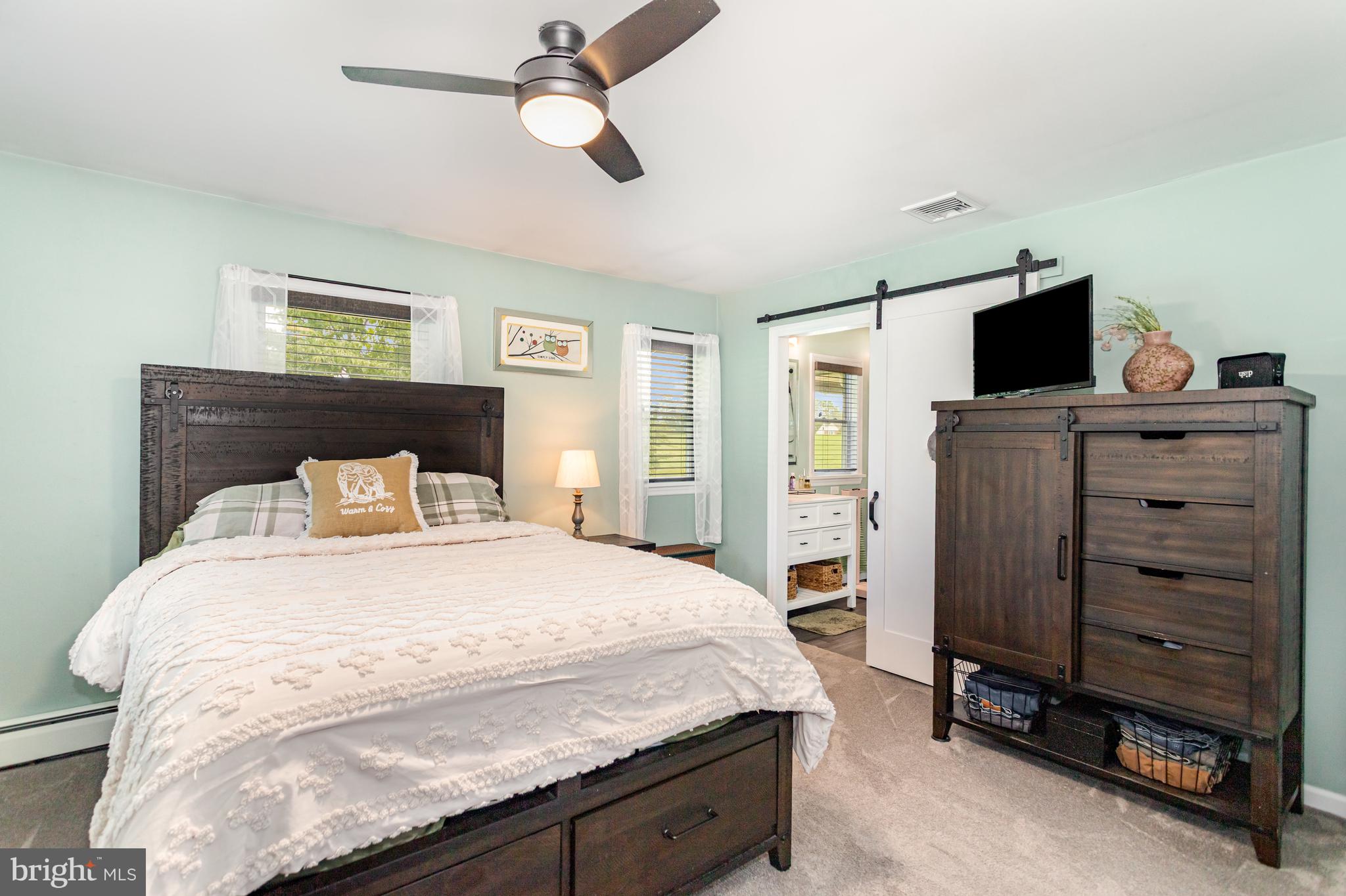107 North Colebrook Road Manheim, PA 17545 - Photo 12 of 35 a bedroom with a bed and a tv on the dresser