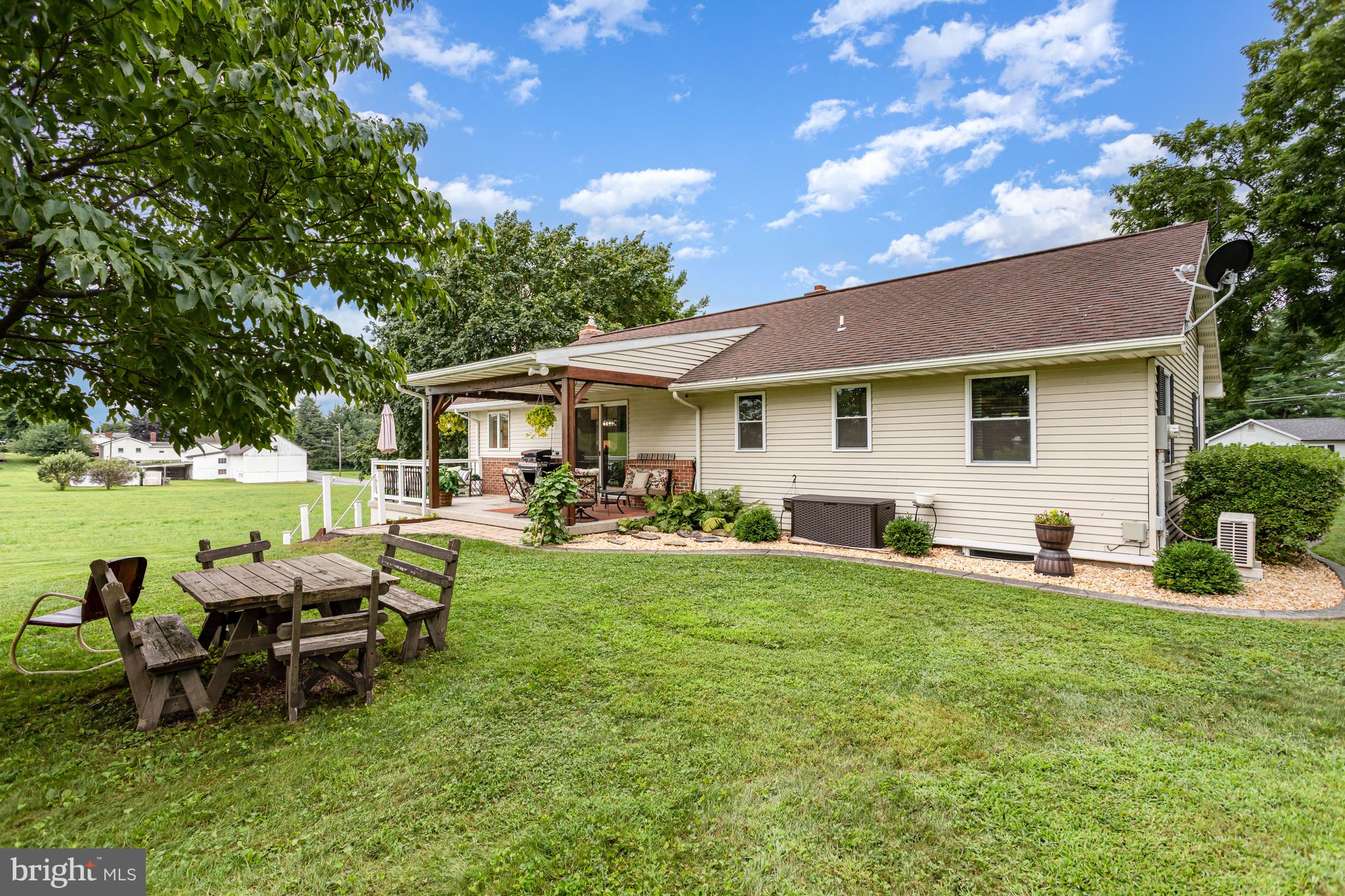 107 North Colebrook Road Manheim, PA 17545 - Photo 24 of 35 a view of a house with backyard sitting area and garden