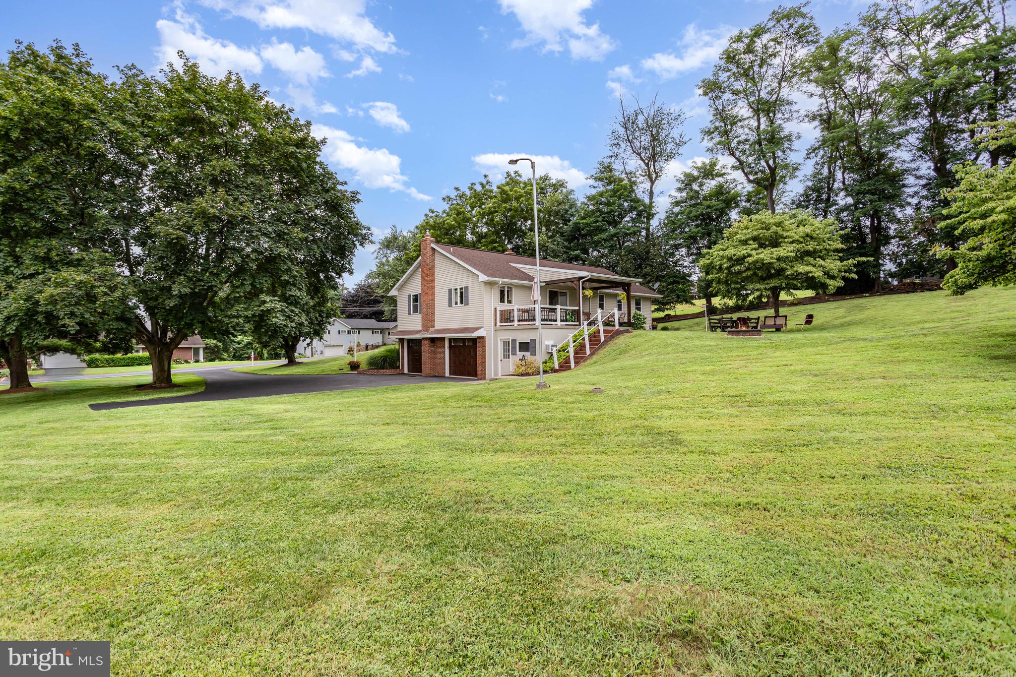 107 North Colebrook Road Manheim, PA 17545 - Photo 27 of 35 a white house with a big yard and large trees