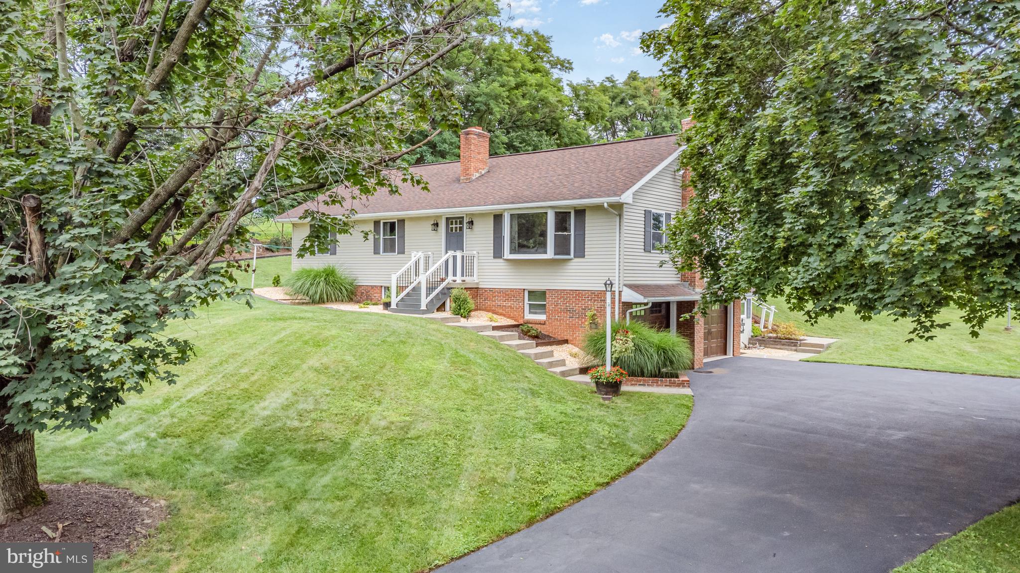 107 North Colebrook Road Manheim, PA 17545 - Photo 3 of 35 a view of a house with a yard and potted plants