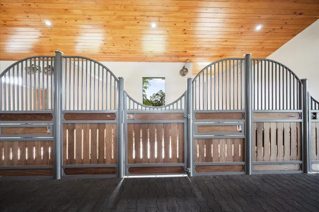 a view of a backyard with wooden fence