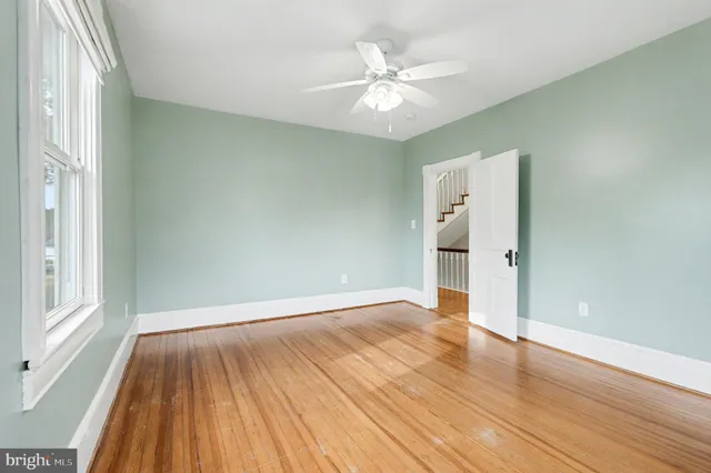 a view of a room with wooden floor