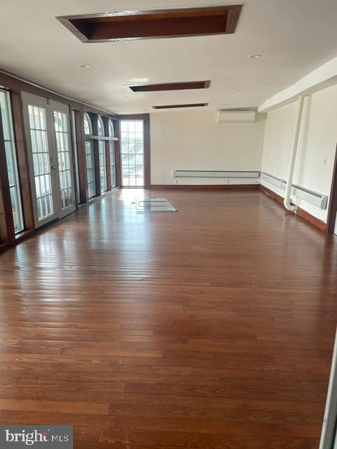 10 Middle Road Levittown, PA 19056 - Photo 3 of 25 a view of an empty room with wooden floor and a window