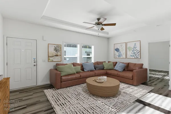 a living room with furniture and a rug