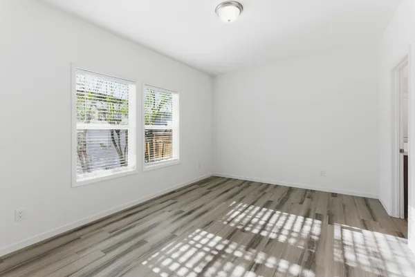 a view of an empty room with a window
