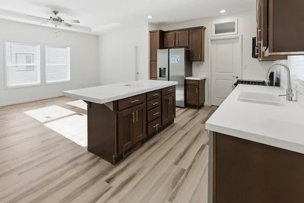 a kitchen with a sink and refrigerator