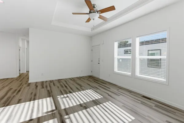 wooden floor in an empty room with a window