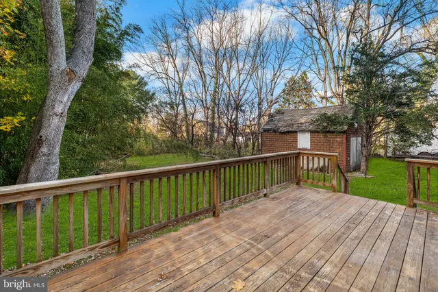a balcony with trees in front of it