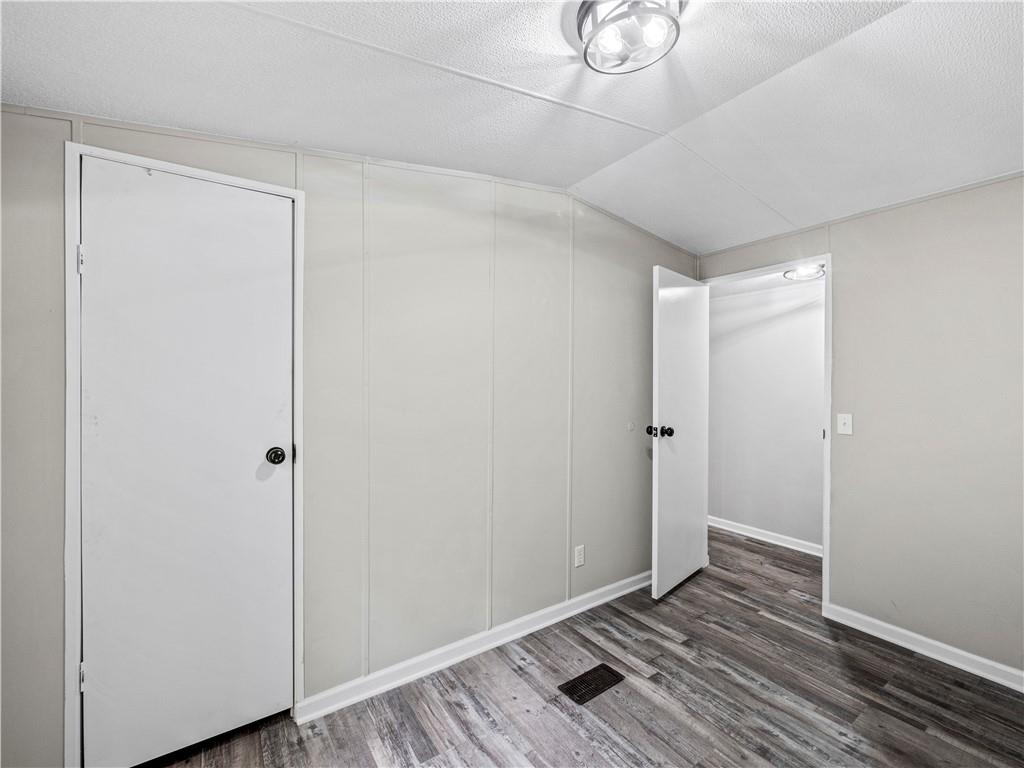 1458 Grant Mill Road Alto, GA 30510 - Photo 11 of 32 a view of an empty room and wooden floor