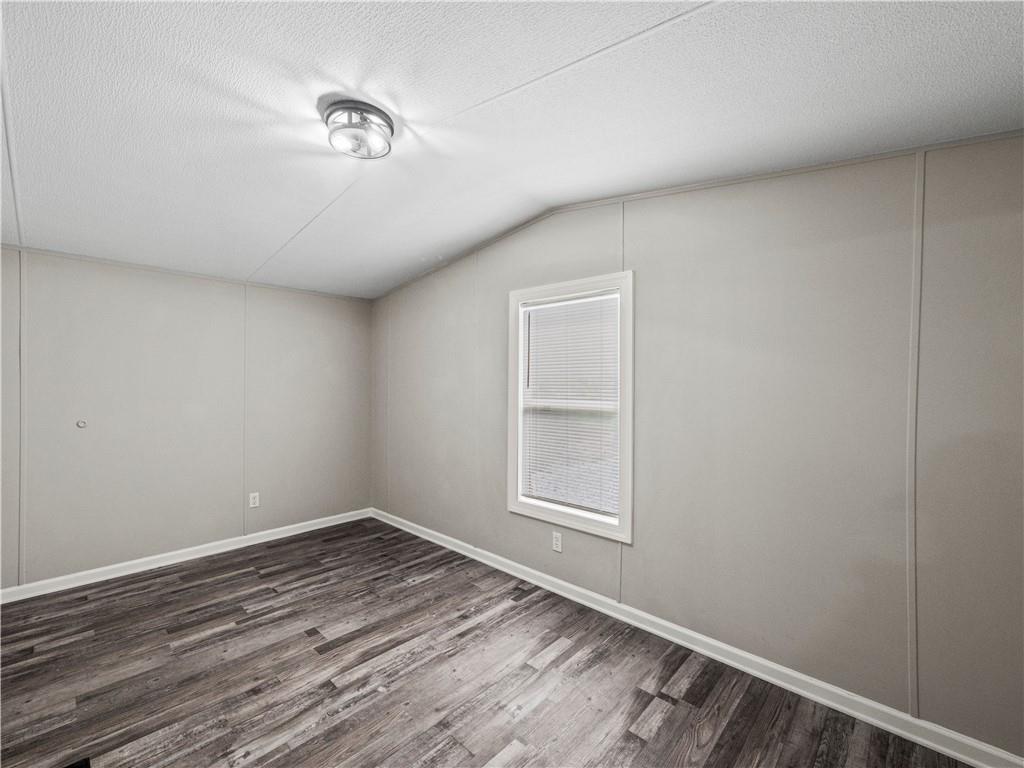 1458 Grant Mill Road Alto, GA 30510 - Photo 13 of 32 a view of empty room with wooden floor and fan