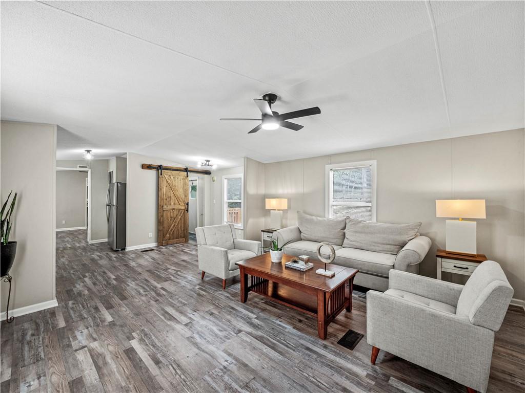 1458 Grant Mill Road Alto, GA 30510 - Photo 16 of 32 a living room with furniture and a wooden floor