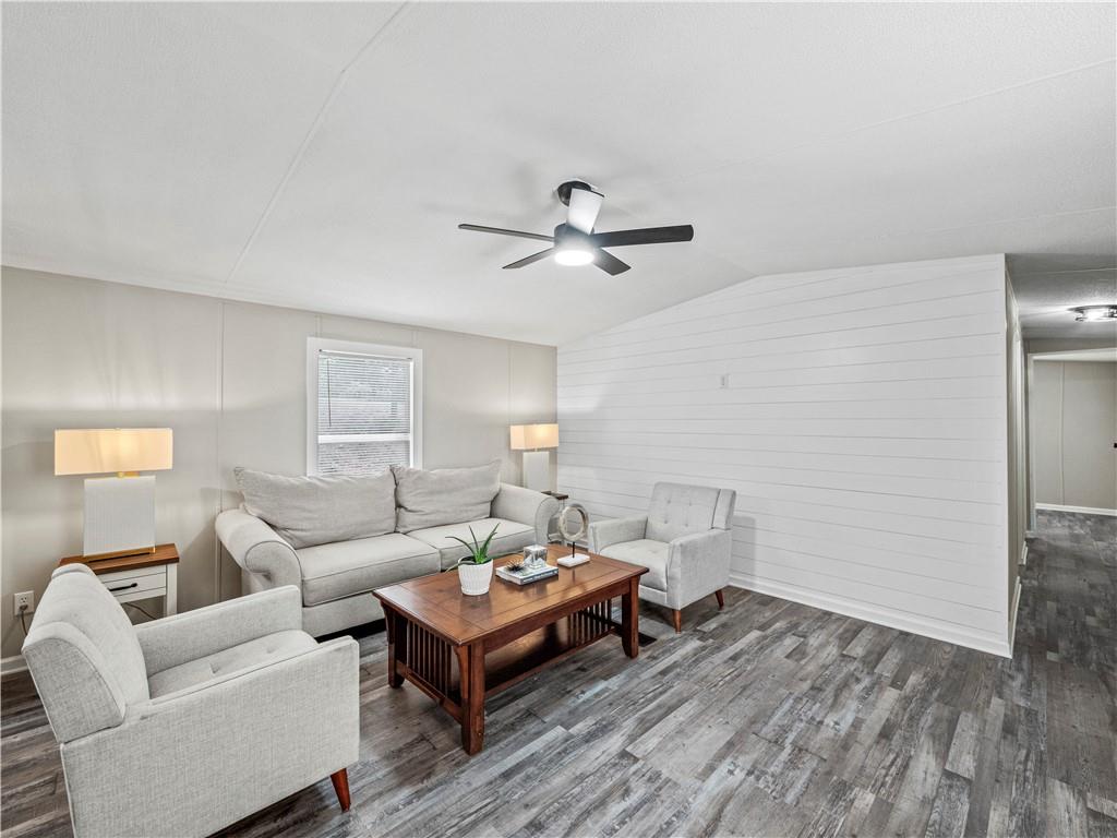 1458 Grant Mill Road Alto, GA 30510 - Photo 17 of 32 a living room with furniture and a wooden floor