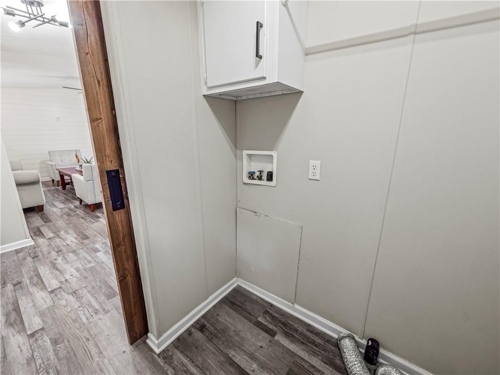 1458 Grant Mill Road Alto, GA 30510 - Photo 20 of 32 a view of a room with wooden floor and bench