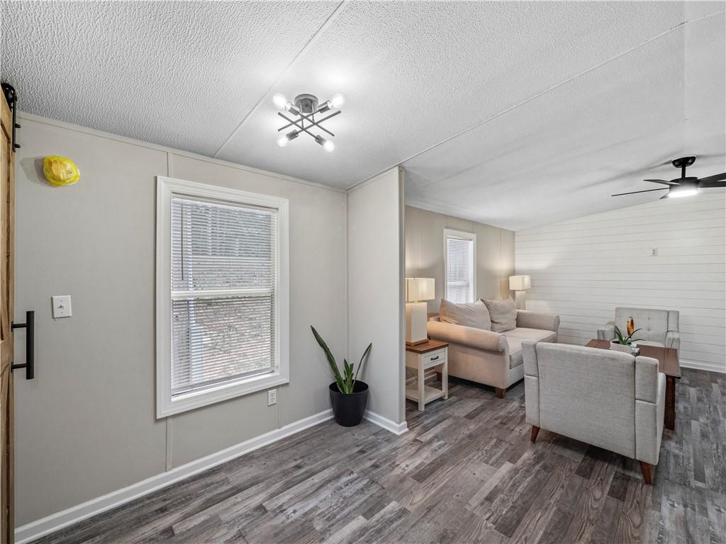 1458 Grant Mill Road Alto, GA 30510 - Photo 22 of 32 a living room with furniture and wooden floor