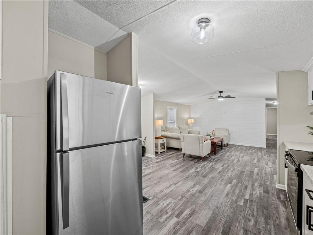1458 Grant Mill Road Alto, GA 30510 - Photo 25 of 32 a white refrigerator freezer sitting in a kitchen