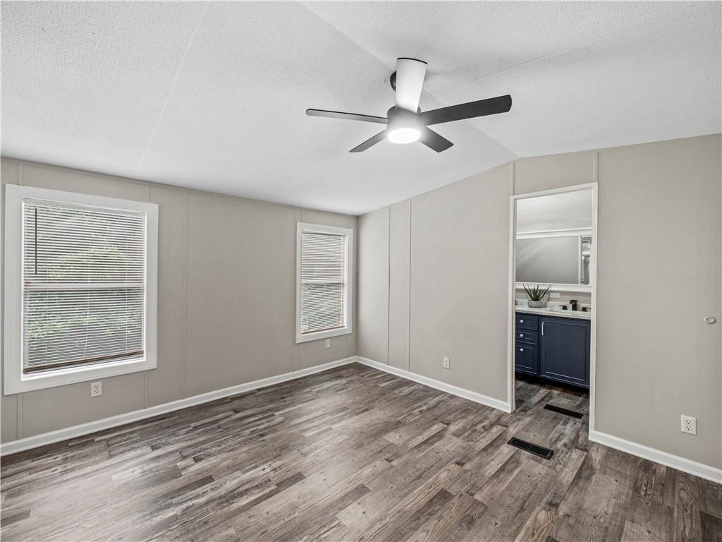 1458 Grant Mill Road Alto, GA 30510 - Photo 29 of 32 a view of empty room with wooden floor and fan