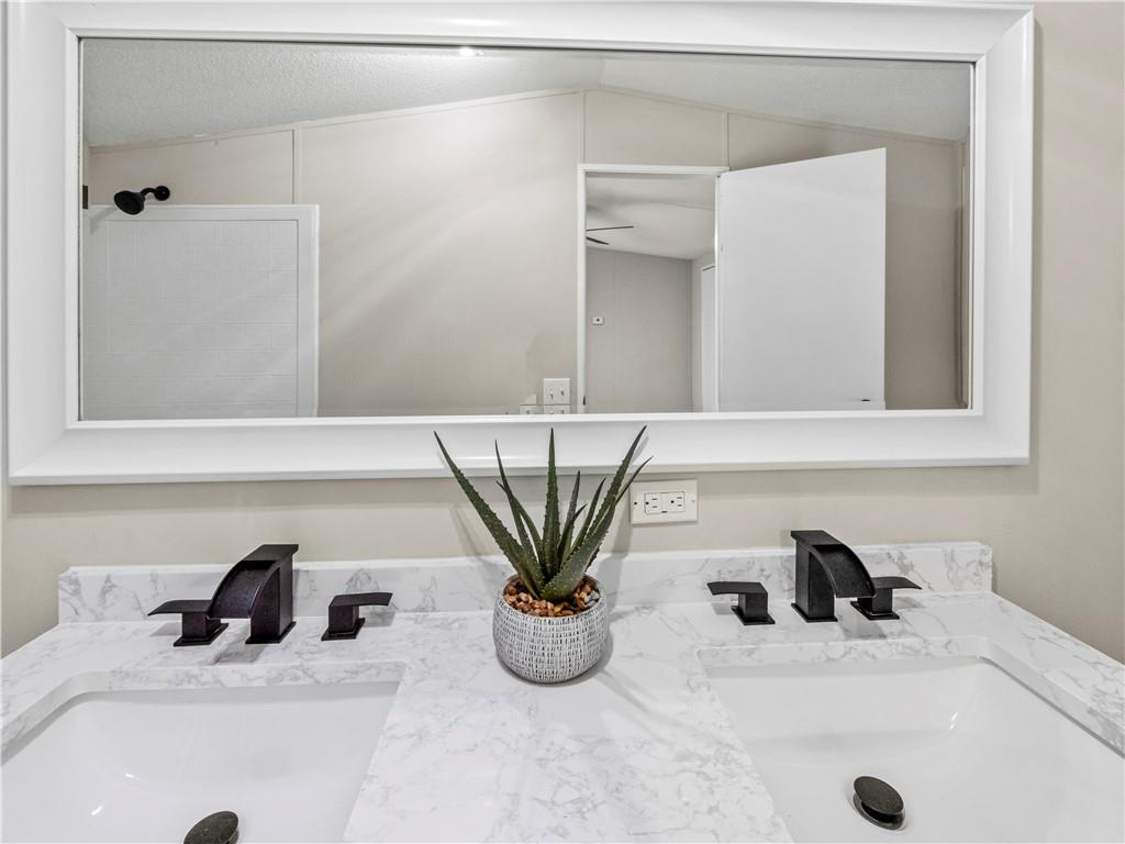 1458 Grant Mill Road Alto, GA 30510 - Photo 32 of 32 a bathroom with a sink and a mirror