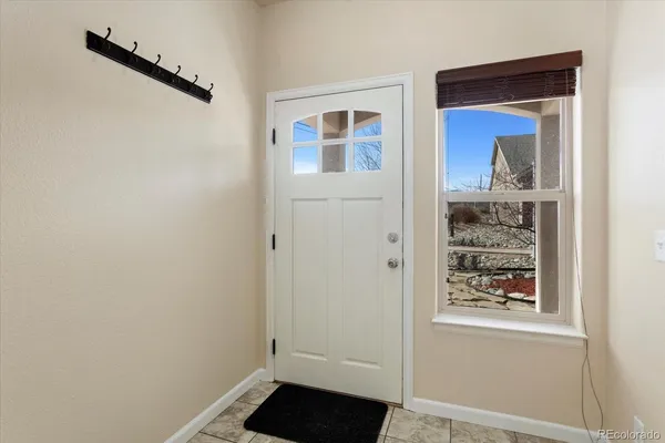 a view of a hallway that has front door