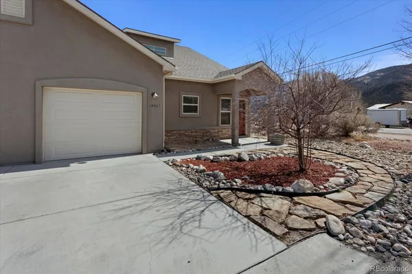 an aerial view of a house with a yard