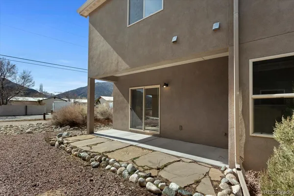 a view of a large house with a street