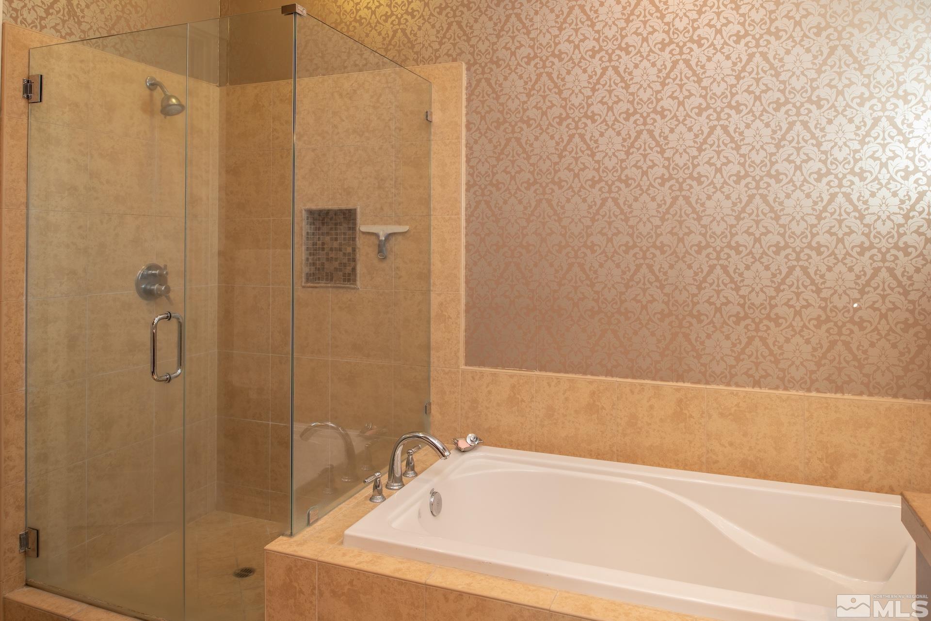 3910 Nature Trail Reno, NV 89511 - Photo 14 of 29 a bathroom with a bathtub and shower