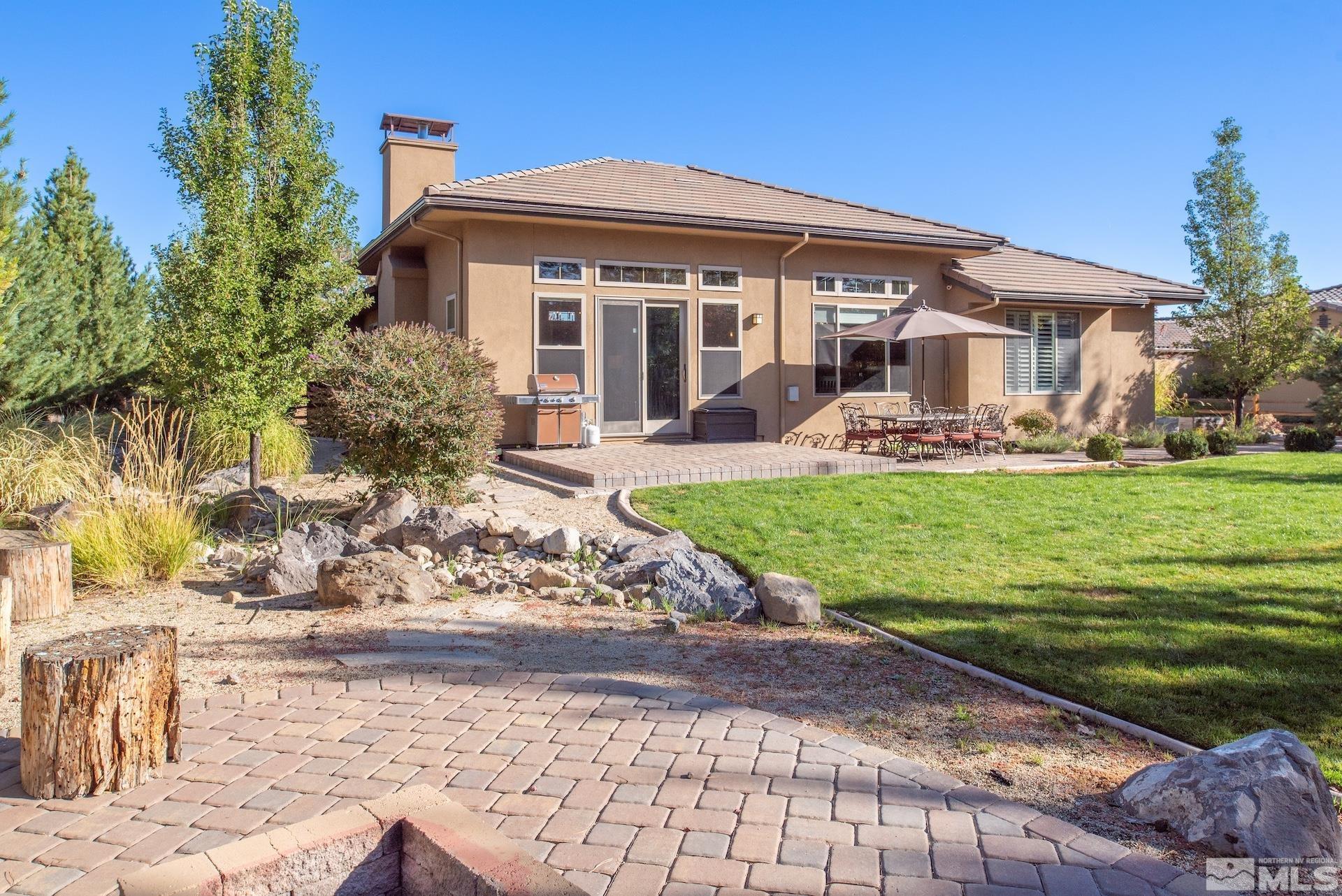 3910 Nature Trail Reno, NV 89511 - Photo 21 of 29 a front view of a house with garden
