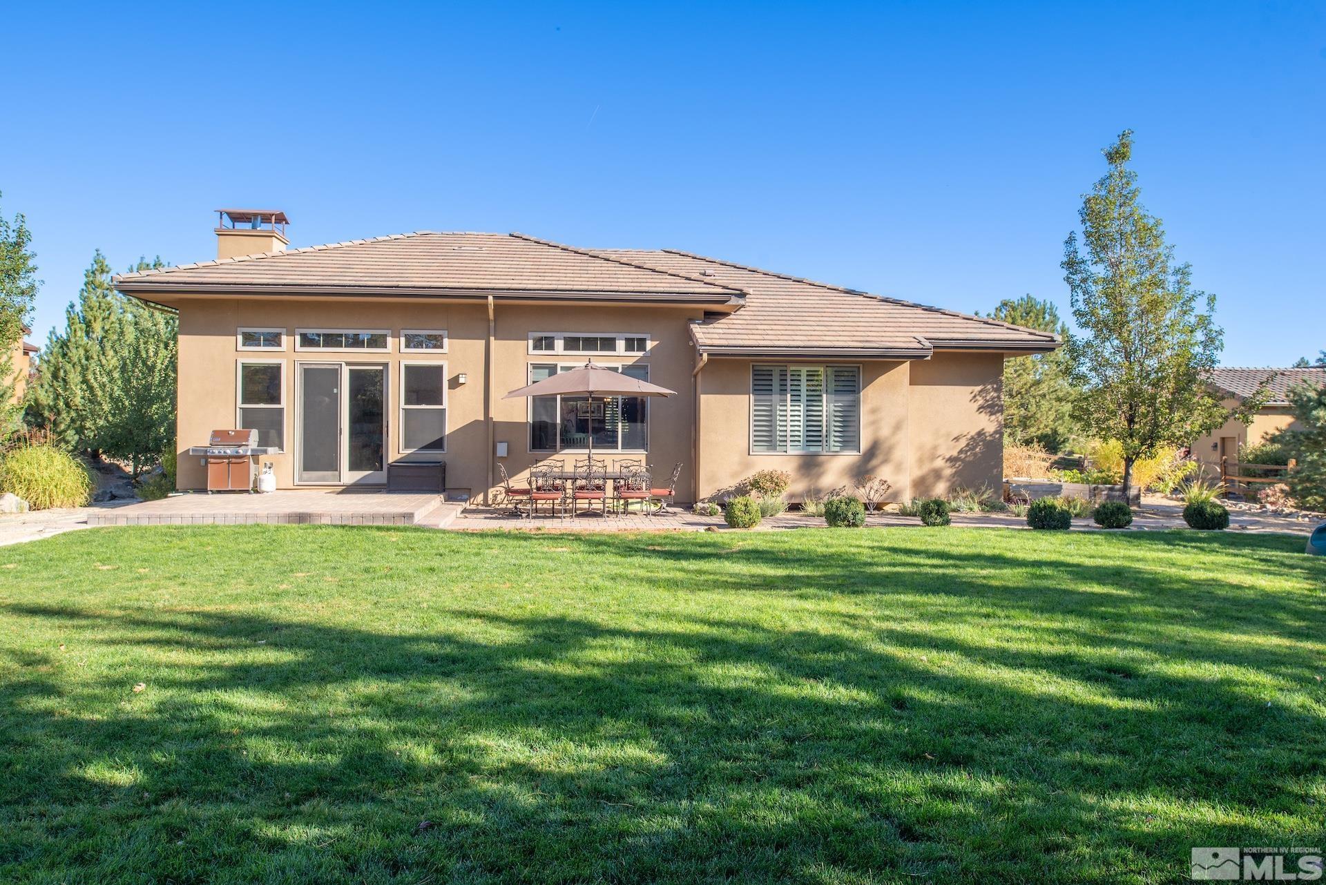 3910 Nature Trail Reno, NV 89511 - Photo 22 of 29 a front view of house with yard barbeque and outdoor seating