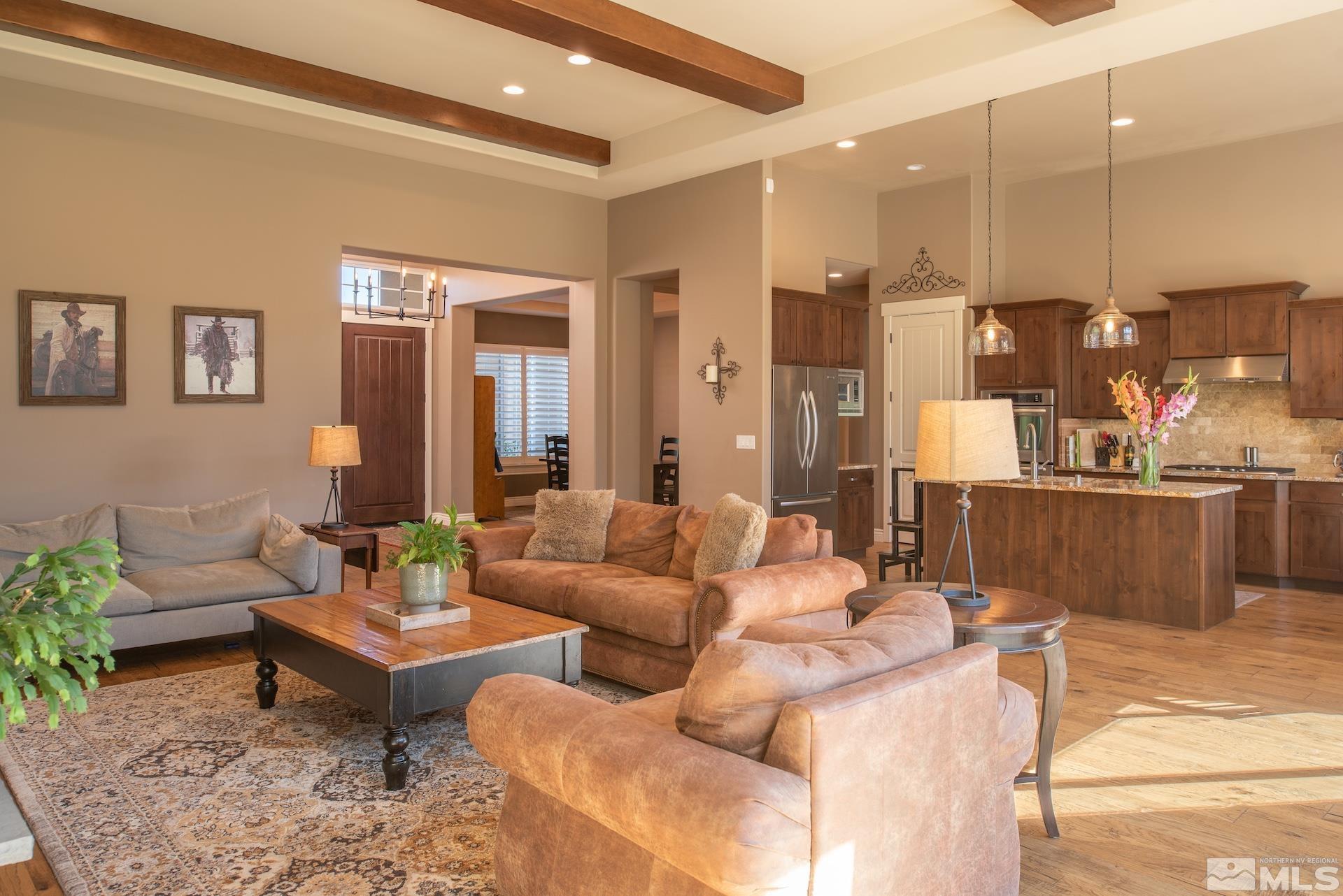 3910 Nature Trail Reno, NV 89511 - Photo 7 of 29 a living room with furniture kitchen view and a chandelier