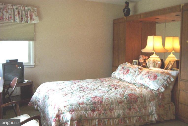 6608 Edenvale Road Baltimore, MD 21209 - Photo 15 of 30 a bedroom with a bed and a window