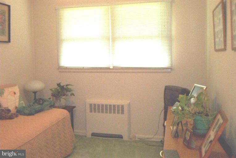 6608 Edenvale Road Baltimore, MD 21209 - Photo 19 of 30 a bedroom with a bed and a window