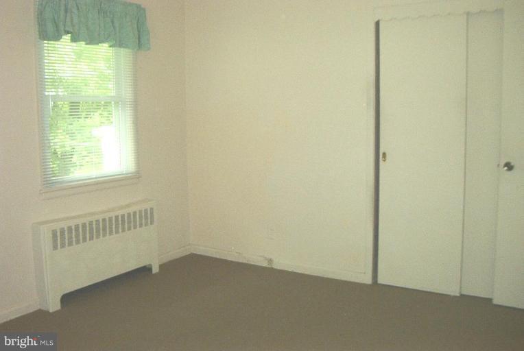 6608 Edenvale Road Baltimore, MD 21209 - Photo 20 of 30 an empty room with windows
