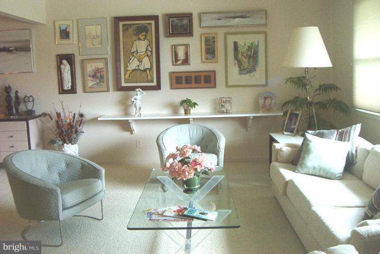 6608 Edenvale Road Baltimore, MD 21209 - Photo 3 of 30 a living room with furniture and painting on the wall