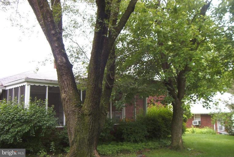 6608 Edenvale Road Baltimore, MD 21209 - Photo 26 of 30 front view of a house with a tree in a yard