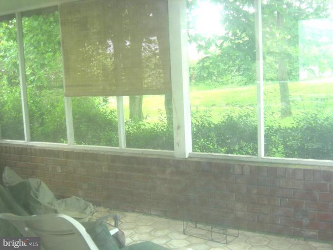 6608 Edenvale Road Baltimore, MD 21209 - Photo 7 of 30 a view of an empty room with a window